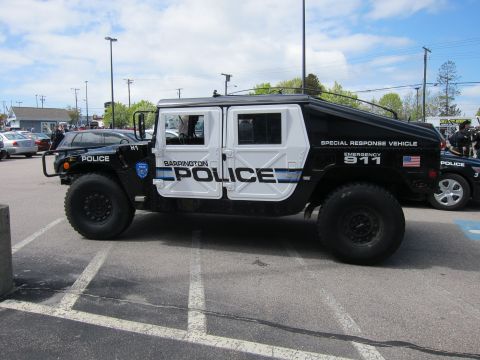 1991 Ford LTD Crown Victoria - Side profile of a black-and-white Barrington Police Hummer H1 Special Response Vehicle with other cruisers nearby.