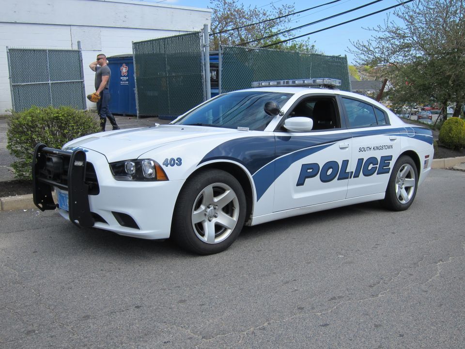 White and blue Dodge Charger South Kingstown Police car with push bar, front three-quarter