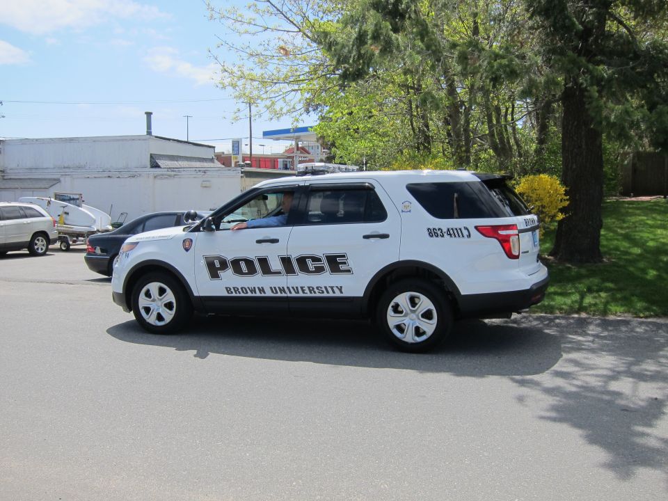 White Ford Explorer Brown University Police SUV, rear three-quarter