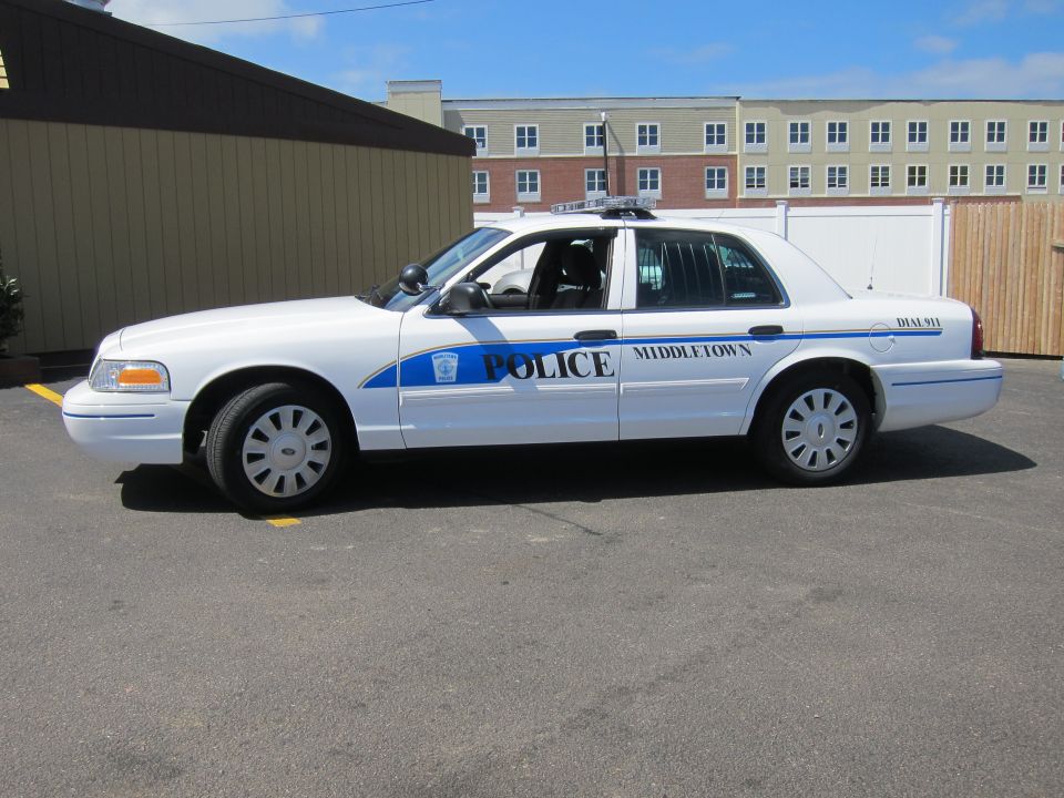 White Ford Crown Victoria Middletown Police cruiser, full side profile