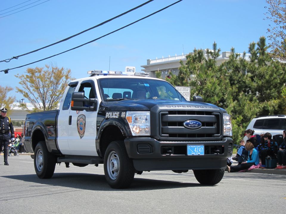 Black-and-white Ford F-250 Super Duty police pickup truck, front three-quarter