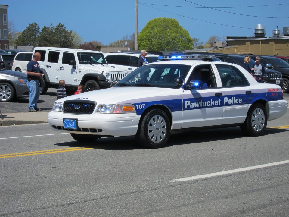 White Ford Crown Victoria marked Pawtucket Police, unit 107
