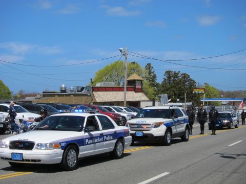 1991 Ford LTD Crown Victoria - Pawtucket Police Crown Victoria and Ford Explorer roll past a row of officers standing in line during a street parade.