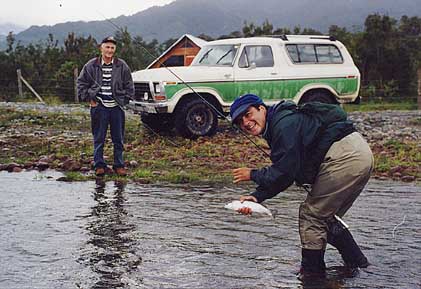 1979 Ford Bronco - Two men enjoy a fishing trip with a classic Ford Bronco nearby.