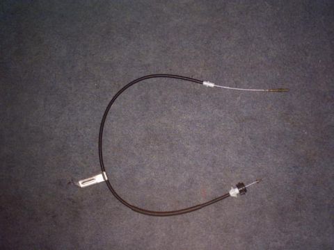 1991 Ford LTD Crown Victoria - A clutch cable is shown against a dark, textured background.