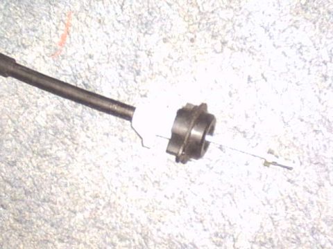 1991 Ford LTD Crown Victoria - This is a close-up view of a clutch cable mechanism, likely a part from a vehicle.