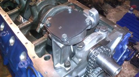 1973 Ford Torino - The oil pump assembly is bolted onto the engine block, with a timing chain nearby.
