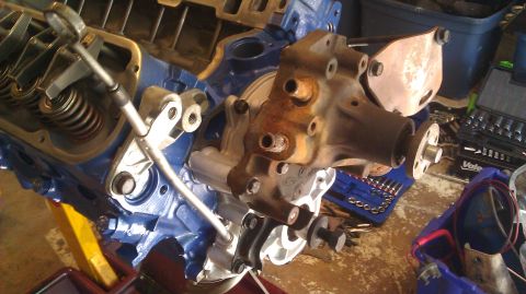1973 Ford Torino - Engine block and water pump assembly during a motor rebuild, with tools laid out.