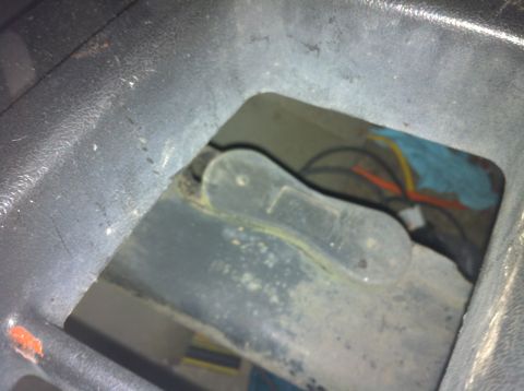 1992 Ford F-150 - Wiring and a latch are visible inside a dark compartment of the vehicle.