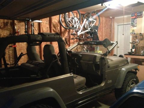 2005 Jeep Wrangler - This 2005 Jeep Wrangler is parked inside a garage, with bicycles mounted on the ceiling.