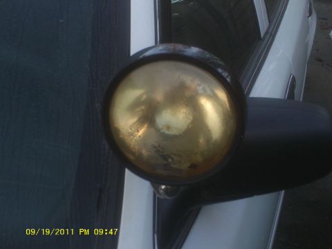 2006 Ford Crown Victoria - A spotlight is attached to the side of a vehicle, with a date stamp of 09/19/2011.