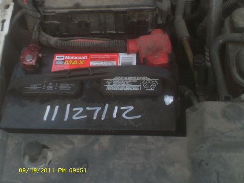 2006 Ford Crown Victoria - A car battery is shown with a Motorcraft MAX label and a handwritten date of 11/27/12.