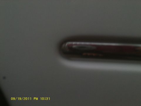 2006 Ford Crown Victoria - Close-up of a car door handle, timestamped 09/19/2011.