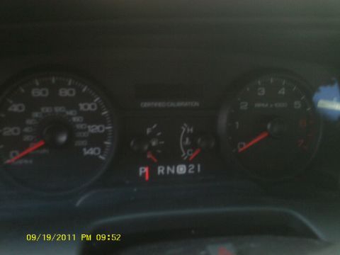 2006 Ford Crown Victoria - Dashboard view of a 2006 Ford Crown Victoria, showing gauges and gear selection.