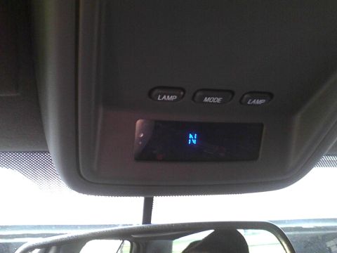 2003 Ford Crown Victoria - Interior view of a vehicle's overhead console with a digital display.