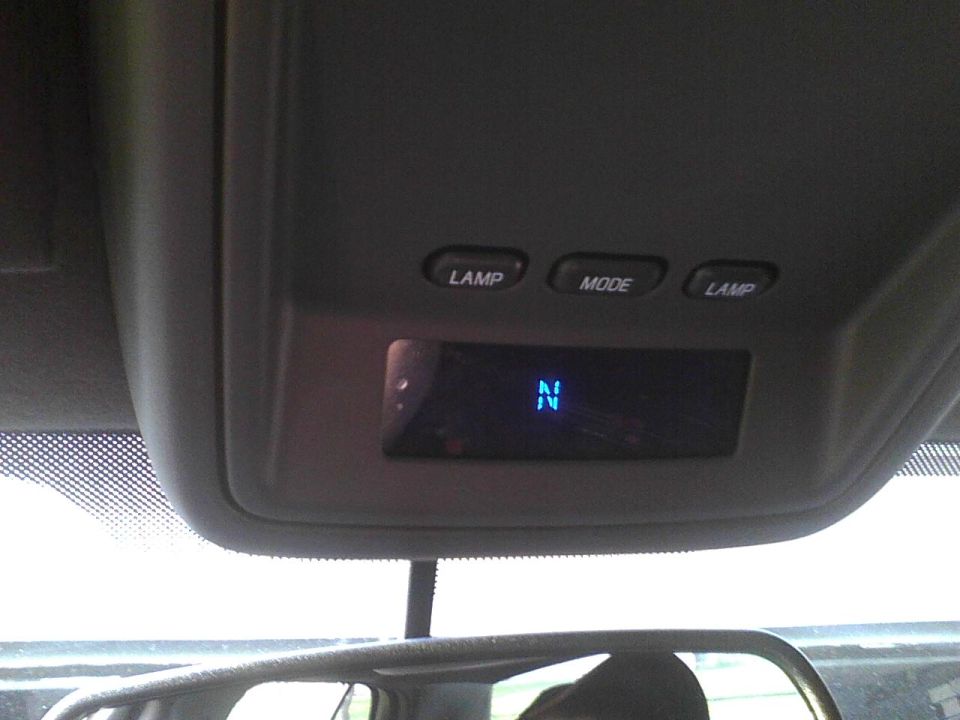 Overhead console with buttons labeled LAMP and MODE, and a digital display showing 'N'