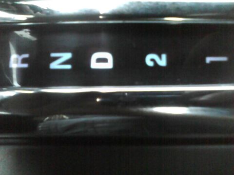 2003 Ford Crown Victoria - Close-up of a gear shifter display showing the available drive modes: Reverse, Neutral, Drive, 2, and 1.