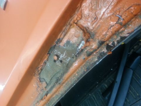 1973 Chevrolet Nova - This image shows significant rust and damage to a vehicle's inner fender well, indicating a need for repair.