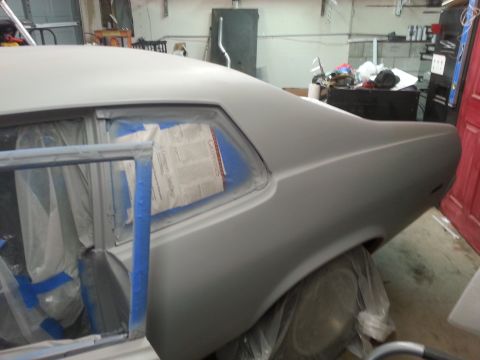 1973 Chevrolet Nova - Car body in primer, windows taped off for painting. This is a 1973 Chevrolet Nova.