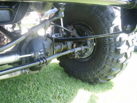 2000 Ford F-250 - This image shows the underside of a vehicle, focusing on the suspension and a large tire.