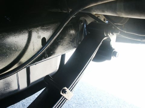 2000 Ford F-250 - Underside view of a vehicle's leaf spring suspension system.