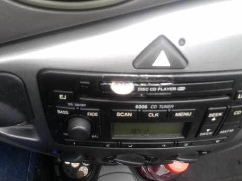 2000 Ford F-250 - Interior view of a car's center console, focusing on the audio system controls and display.