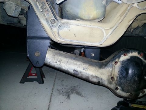1991 Ford Bronco - Custom lift kit bracket installed on the rear axle of a vehicle.