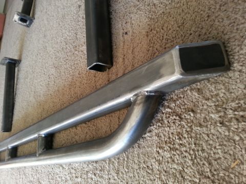 1991 Ford Bronco - Metal tubing parts are shown on a carpeted surface, with a SuperMotors logo in the corner.