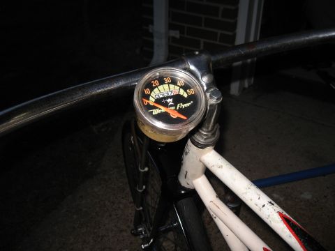 1994 Ford Bronco - A close-up of a vintage bicycle's handlebars and a "Western Flyer" speedometer.