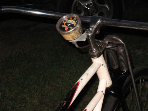 1994 Ford Bronco - A close-up view of a bicycle's front end, showing the handlebars and a speedometer.