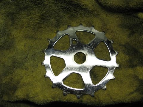 1994 Ford Bronco - A single bicycle chainring is shown on a green textured surface.
