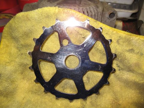 1994 Ford Bronco - A close-up of a shiny bicycle chainring, likely a replacement part, is shown on a yellow cleaning cloth.