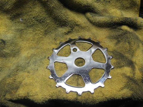 1994 Ford Bronco - A chrome bicycle chainring rests on a yellow towel.