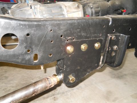 1992 Ford Bronco - Close-up of a vehicle's frame and transmission, showing suspension attachment points.