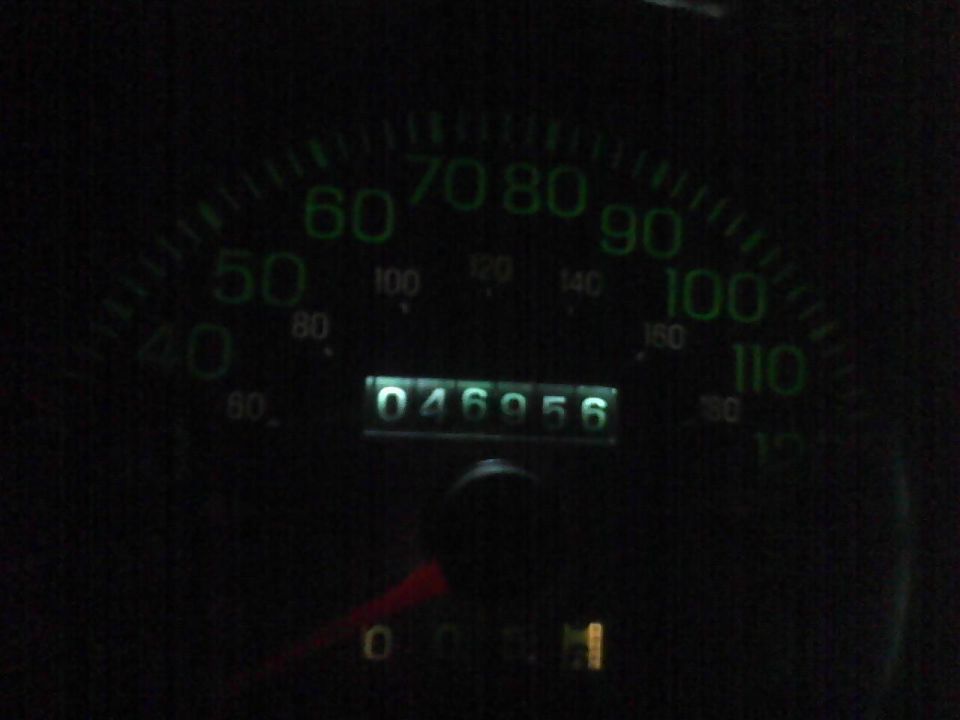 Speedometer and odometer showing 46956 miles