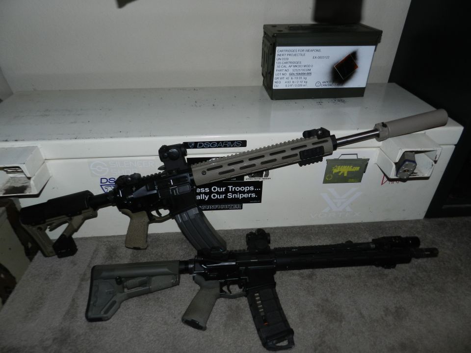 Two rifles and an ammo can on a white surface