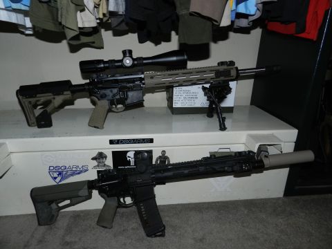 1996 Ford Bronco - Two assault rifles are shown, one with a scope and bipod, resting on a white box.