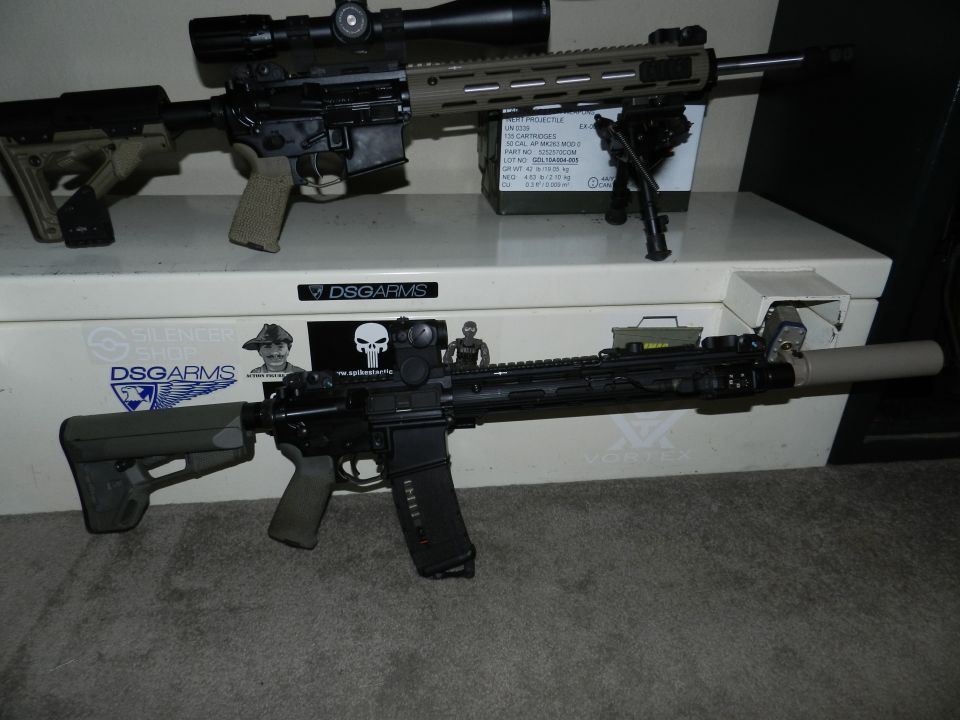 Two rifles with scopes and bipods on a white surface