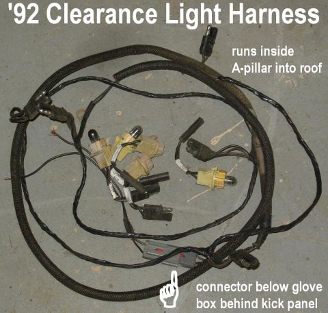 Clearance light wiring harness with bulb sockets and connectors on concrete floor