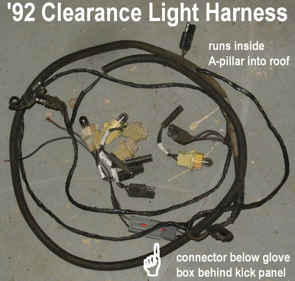 Clearance light wiring harness with bulb sockets and connectors on concrete floor