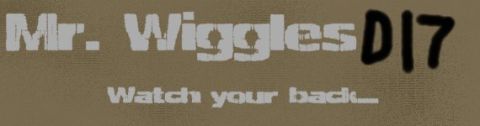 1998 Mercury Sable - Text graphic with "Mr. Wiggles D17" and "Watch your back..." on a textured brown surface.