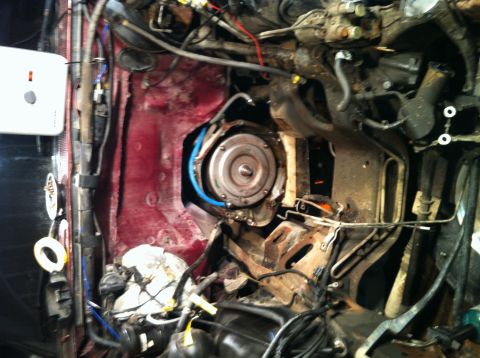 1996 Ford Bronco - The engine bay of a 1996 Ford Bronco, with a clear view of the transmission torque converter and surrounding components.