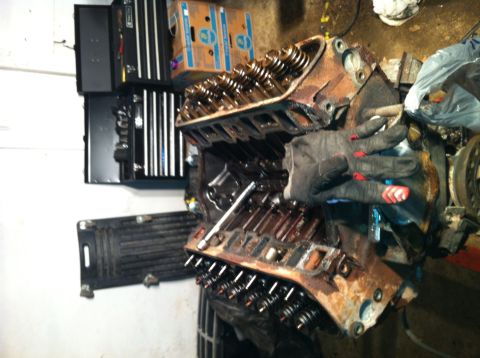 1996 Ford Bronco - A disassembled engine block is shown with its valve train components visible.