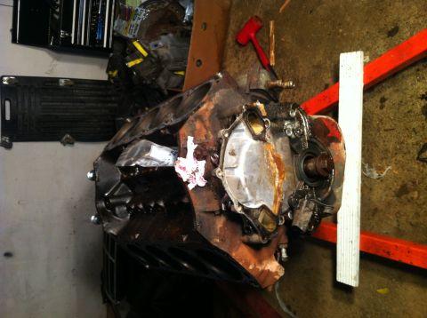 1996 Ford Bronco - Disassembled engine block resting on an engine stand, with tools nearby.
