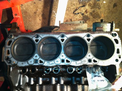 1996 Ford Bronco - Close-up view of an engine block, showing the cylinder bores and pistons.
