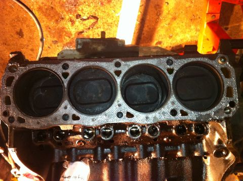 1996 Ford Bronco - Close-up view of an engine block showing pistons within the cylinders.