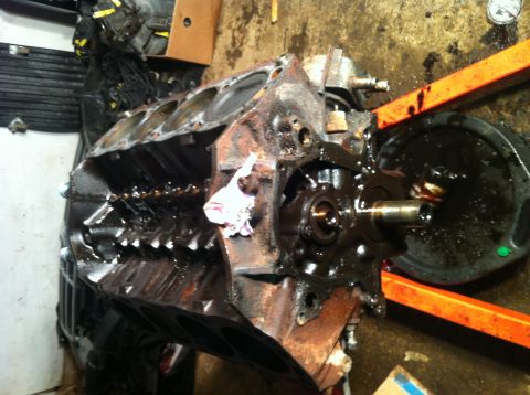 1996 Ford Bronco - This is a close-up view of an engine block, showing internal components and oil residue.