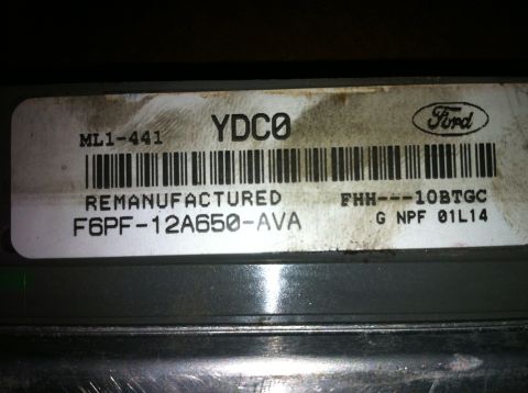 1996 Ford Bronco - Close-up of a Ford remanufactured engine control module showing part numbers and manufacturing date.