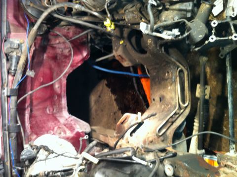 1996 Ford Bronco - Close-up view of a vehicle's engine bay, showing mechanical components and wiring.