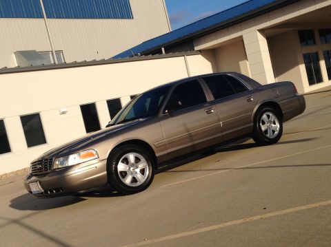 2005 Ford Crown Victoria - This 2005 Ford Crown Victoria sedan is shown from a three-quarter front angle.